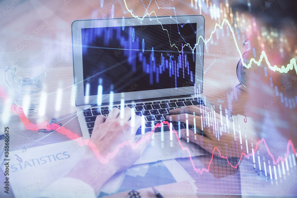 Multi exposure of forex graph with man working on computer on background. Concept of market analysis. Multi exposure of forex graph with man working on computer on background. Concept of market analysis.
