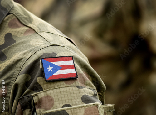 Bild auf Leinwand Flag of Puerto Rico on military uniform