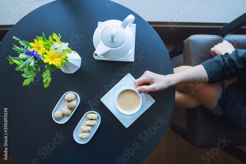 A delicious coffe with cookies is serving in a elegance restaurant or cafe photo