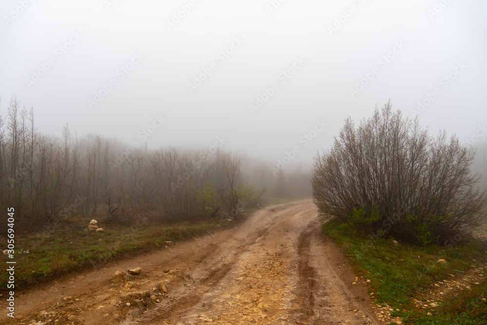 Fototapeta premium Mud and clay on a rural road in the rain