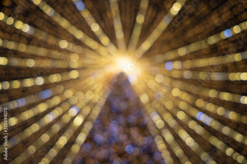 Wallpaper Mural Blurred christmas background with big and bright christmas tree lights Torontodigital.ca