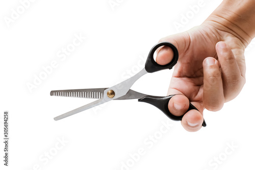 hand holding hair scissors on white