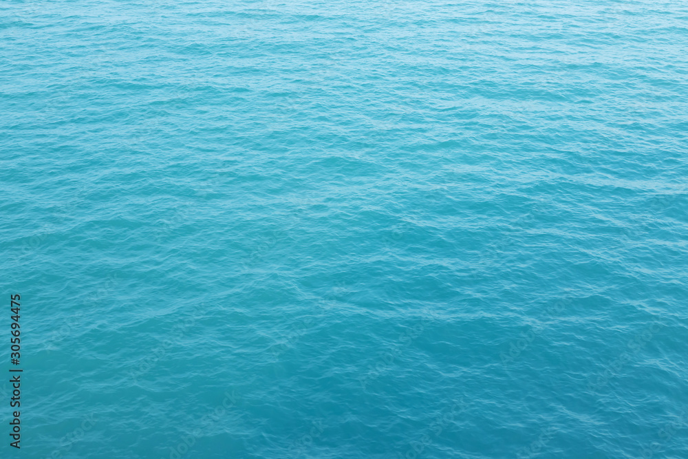 Blue Sea surface aerial view with waves from a drone, empty blank to background. soft focus. Blue Sea surface aerial view with waves from a drone, empty blank to background. soft focus.