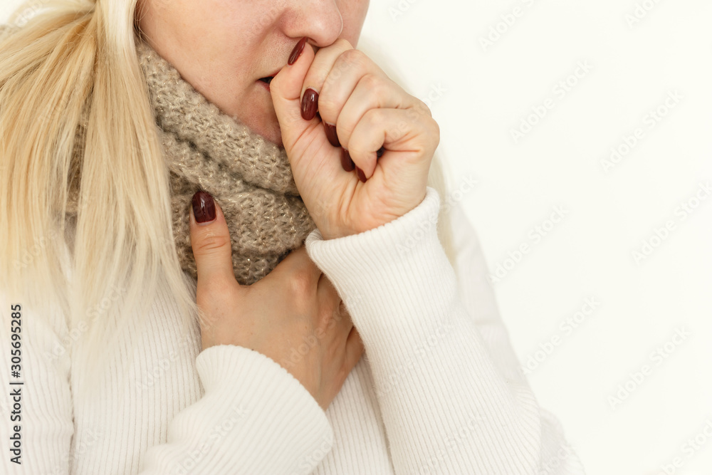 Young ill female have a cough and sore throat in winter. Causes of