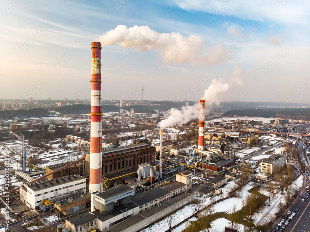 Aerial view of heating plant and thermal power station. Combined power station for city district heating and generating electrical power. Industrial zone from above, Vilnius, Lithuania.