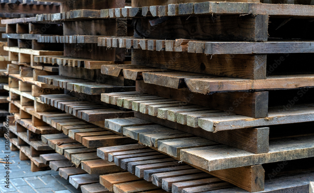 Beautiful construction background. pile of building wooden pallets.