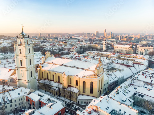 Beautiful Vilnius city panorama in winter with snow covered houses, churches and streets. Winter city scenery in Vilnius, Lithuania.