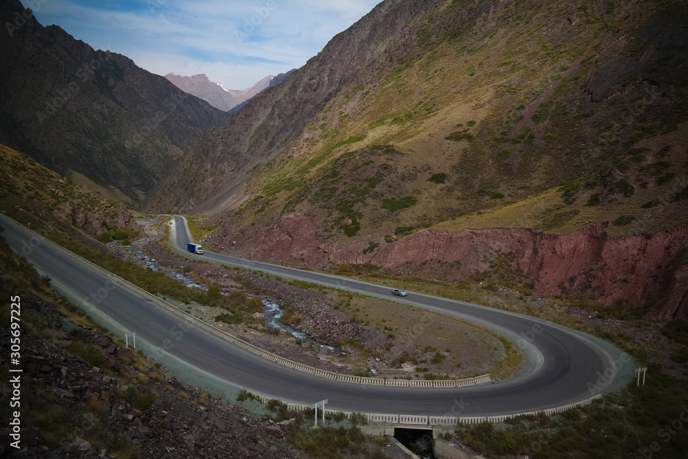 Serpentine road in Too-Ashuu pass and Kara Balta river and valley,Chuy Region of Kyrgyzstan
