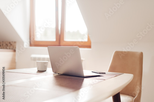 Canvas Print Telecommuting workspace with laptop and smartphone