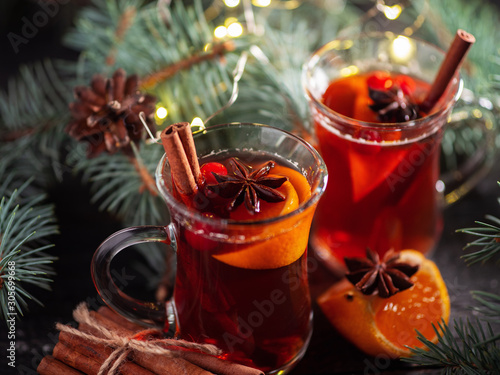 Christmas winter mulled wine from red wine with spices and fruit tangerines with cinnamon . Traditional alcoholic hot drink