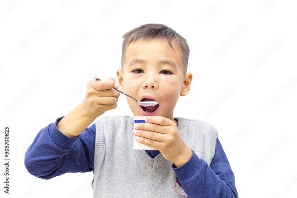 Happy baby eating yogurt isolated on white Happy baby eating yogurt isolated on white