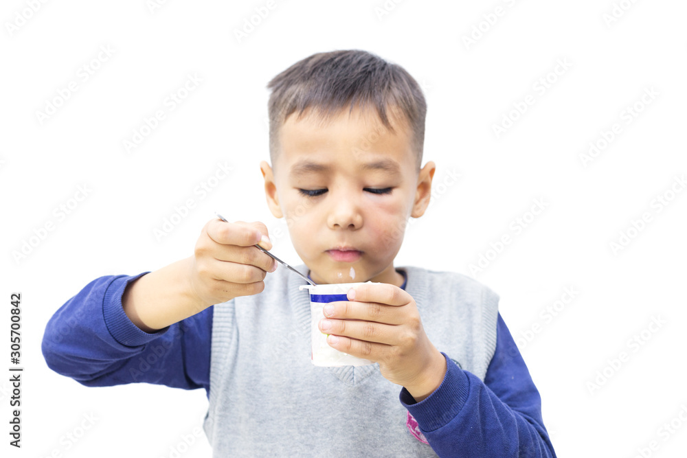 Happy baby eating yogurt isolated on white Happy baby eating yogurt isolated on white
