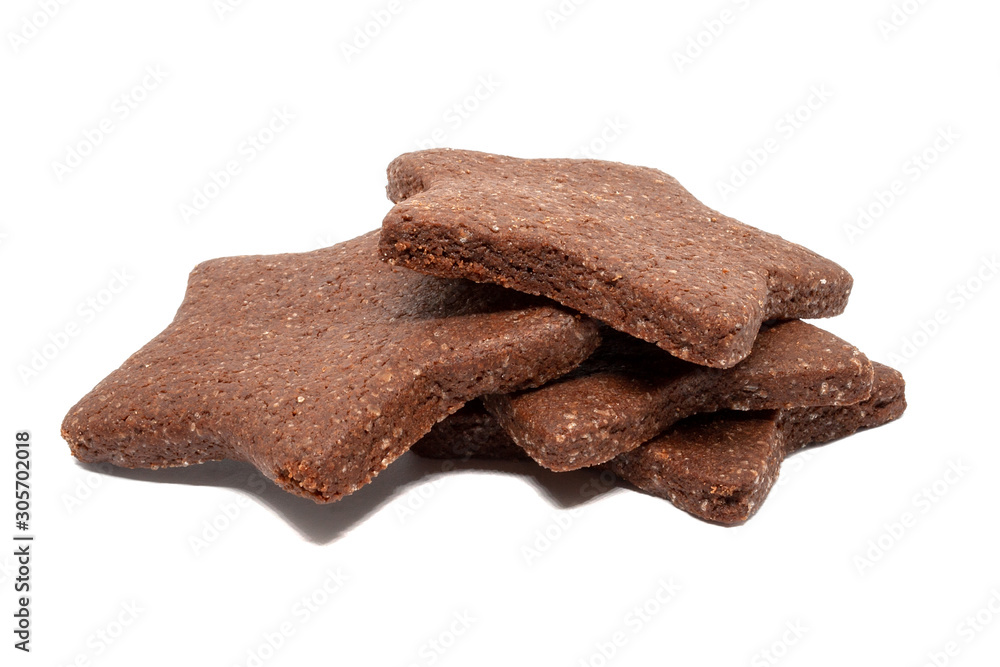 A pile of delicious homemade chocolate and sugar cookies in the shape of stars isolated on a white background. Holiday baking for the whole family
