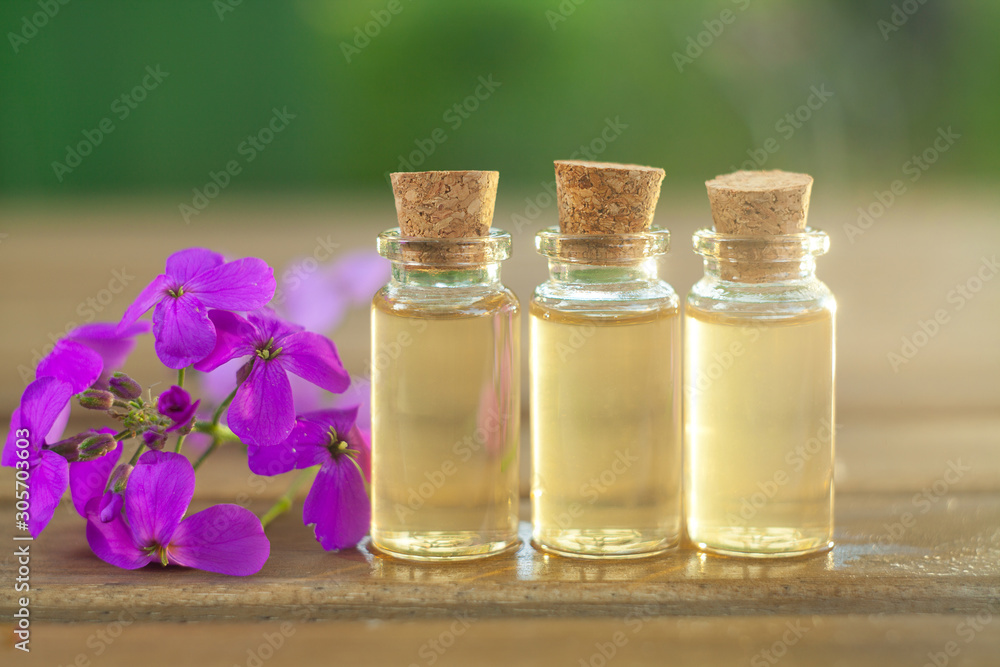 Essence of flowers on table in beautiful glass jar Essence of flowers on table in beautiful glass jar