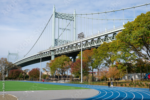 Astoria Park with an Athletic Track looking towards the Triborough Bridge in Astoria Queens New York