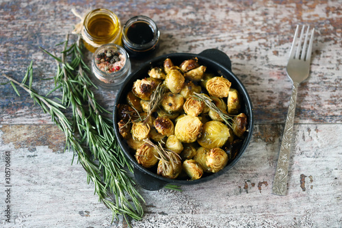 Slika na platnu Baked Brussels sprouts with rosemary and spices