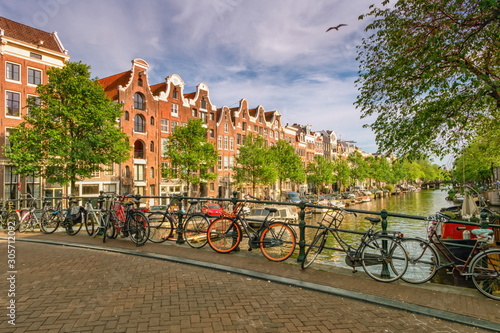 Typical buildings, canal and bikes in Amsterdam, Netherlands
