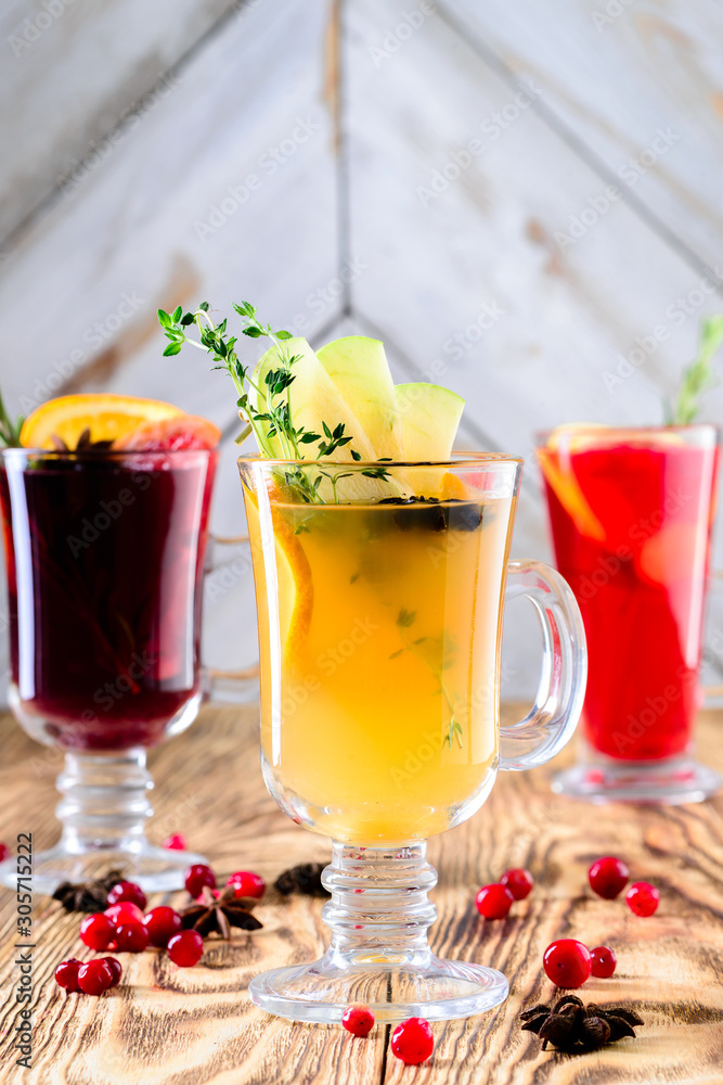 three glasses mulled wine on a rustic wooden table copy space background three glasses mulled wine on a rustic wooden table copy space background