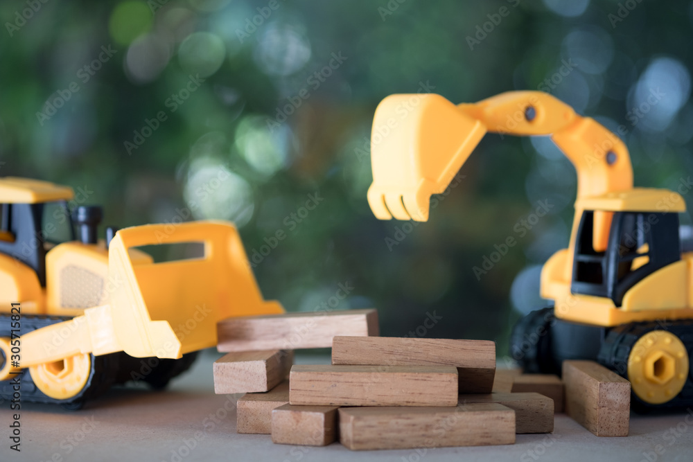Diorama construction with yellow construction machinery models. Diorama construction with yellow construction machinery models.