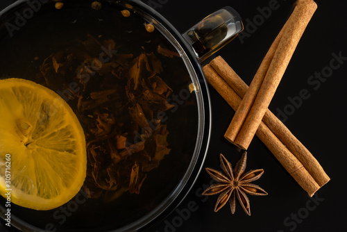 tea with lemon. star anise and cinnamon sticks top view