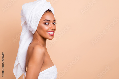 Close-up profile side view portrait of nice-looking attractive gorgeous well-groomed cheerful cheery lady after taking useful bath healing isolated on beige pastel background
