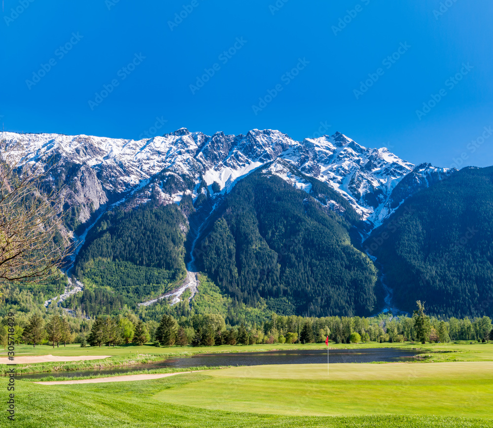 Golf course with gorgeous green and fantastic mountain view.