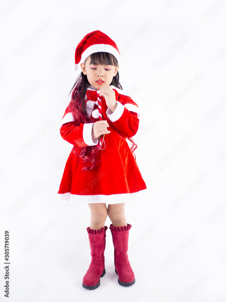 Asian girl is wearing a Santa costume to celebrate Christmas. White background Asian girl is wearing a Santa costume to celebrate Christmas. White background
