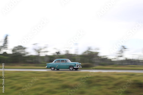 car on the road in cuba