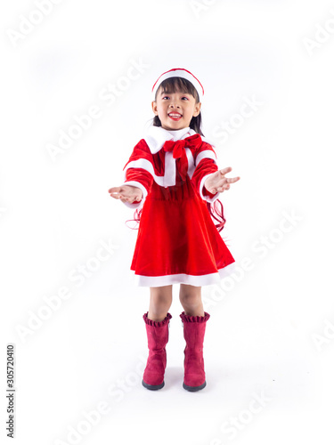 Asian girl is wearing a Santa costume to celebrate Christmas. White background