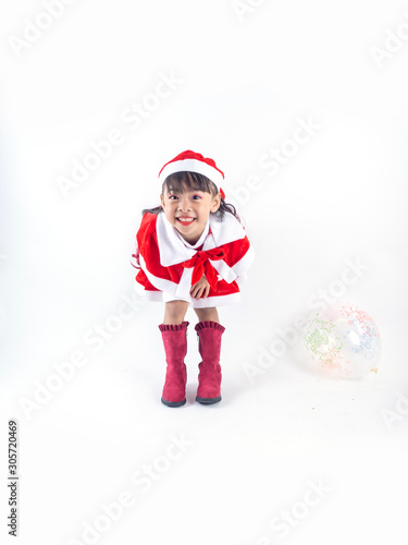 Asian girl is wearing a Santa costume to celebrate Christmas. White background