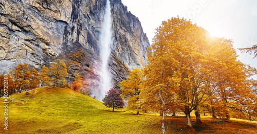 Lauterbrunnen valley, village of Lauterbrunnen, waterfalls and the Lauterbrunnen Wall in Swiss Alps, Switzerland