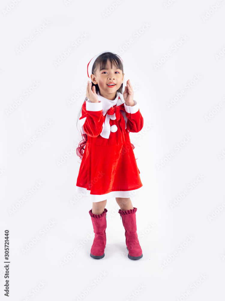Asian girl is wearing a Santa costume to celebrate Christmas. White background Asian girl is wearing a Santa costume to celebrate Christmas. White background