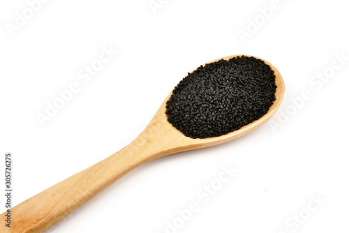 Lemon basil seeds in wooden spoon isolated on white background.food for help Reduce Cholesterol Levels For those who need to control weight