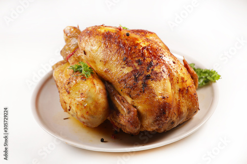 roasted chicken in plate, top view