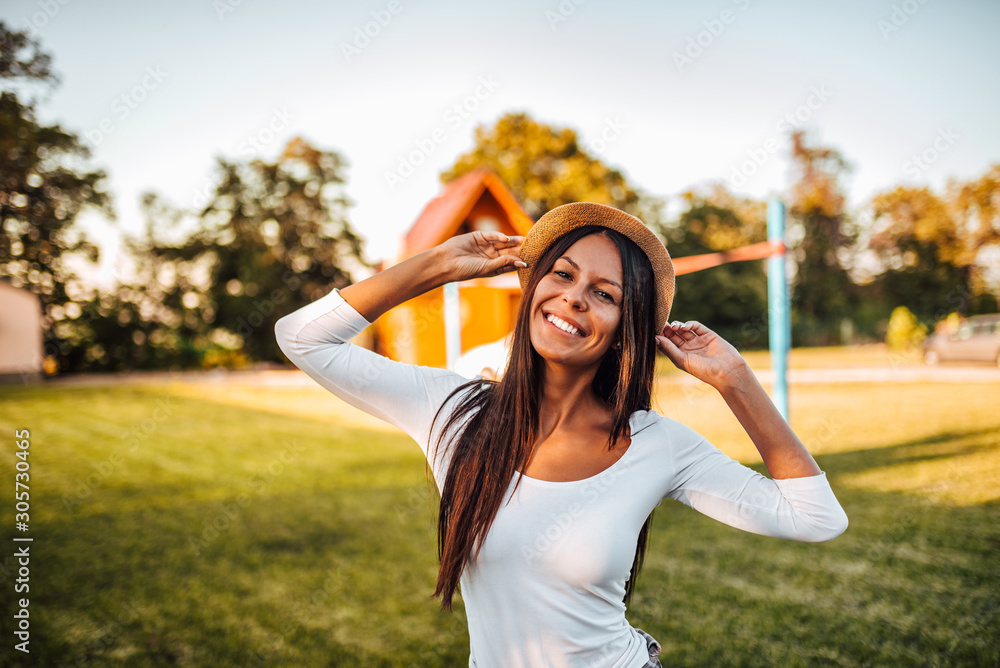 Outdoors portrait of a beautiful young woman relaxing on a summer vacation. Outdoors portrait of a beautiful young woman relaxing on a summer vacation.