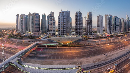 Aerial top view to Sheikh Zayed road near Dubai Marina and JLT night to day timelapse, Dubai.