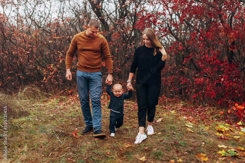Happy family resting in beautiful autumn park Happy family resting in beautiful autumn park