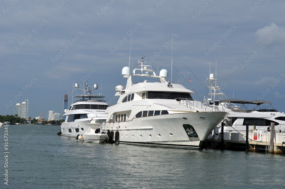 Luxury motor yachts moored at a southeast Florida marina
