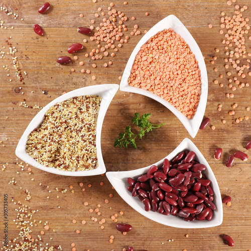 rice, lentil and bean on wood background