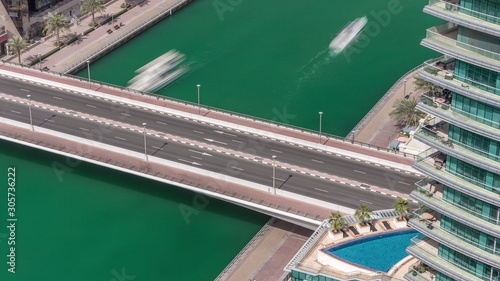 Waterfront promenade in Dubai Marina aerial timelapse. Dubai, United Arab Emirates