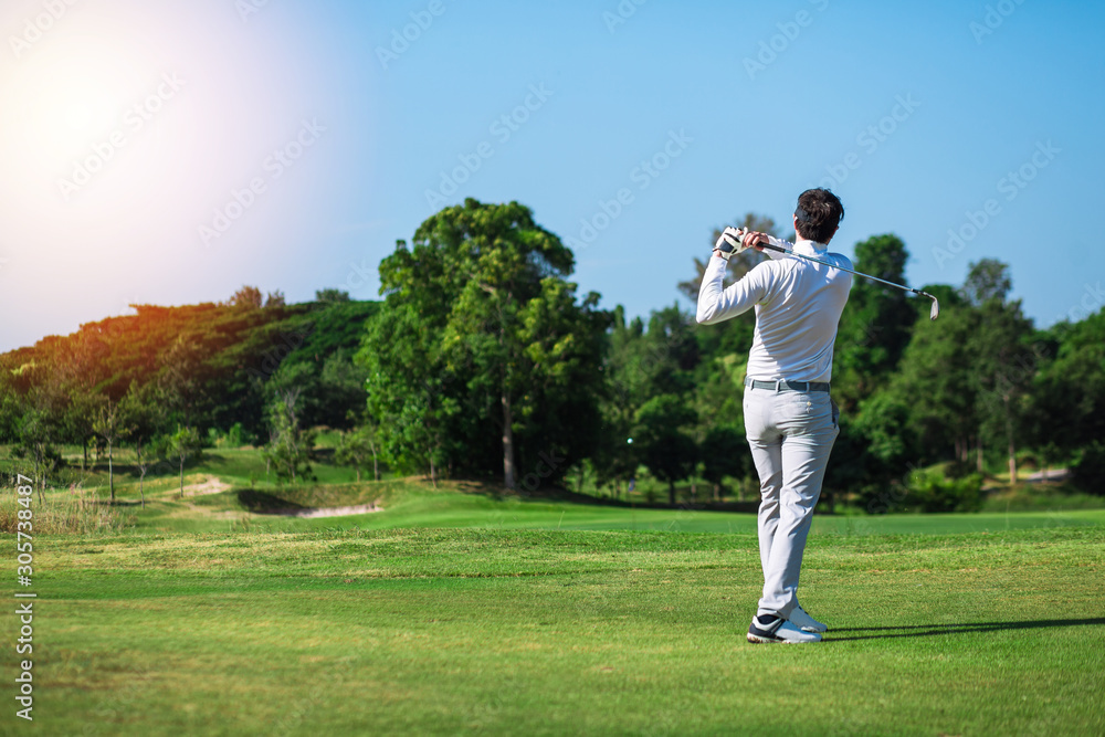 Golfers hit sweeping golf course in the summer. golfers concept.