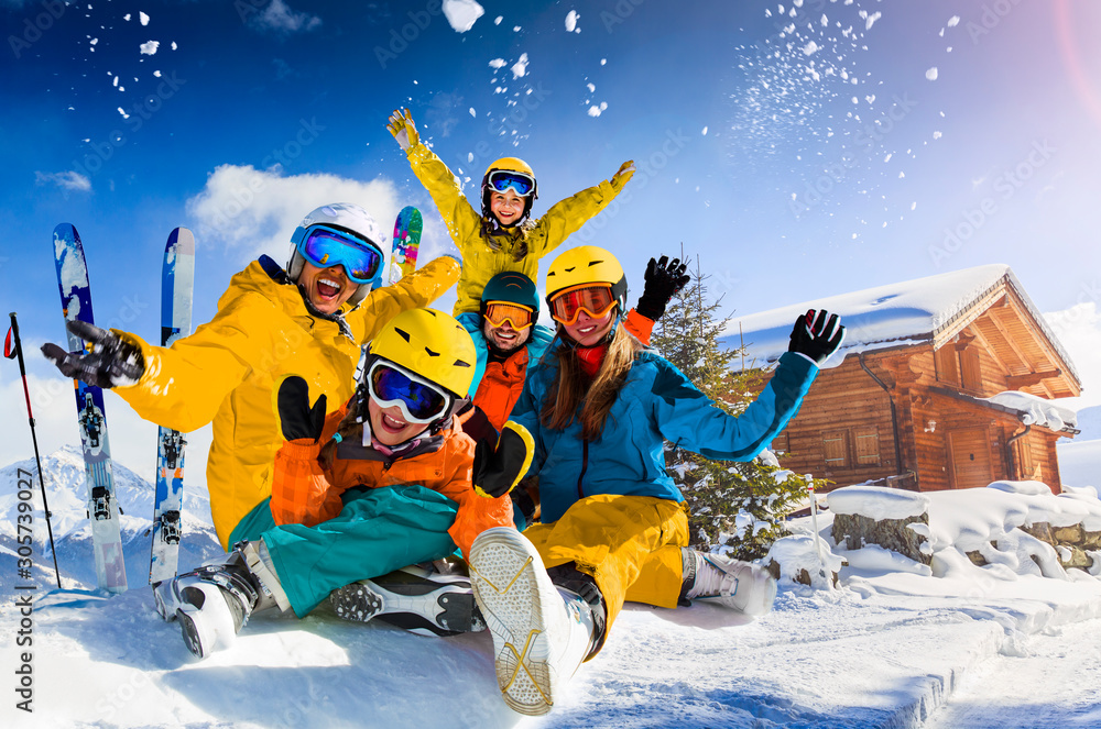 Happy family enjoying winter vacations in mountains. Playing with snow, Sun in high mountains. Winter holidays.