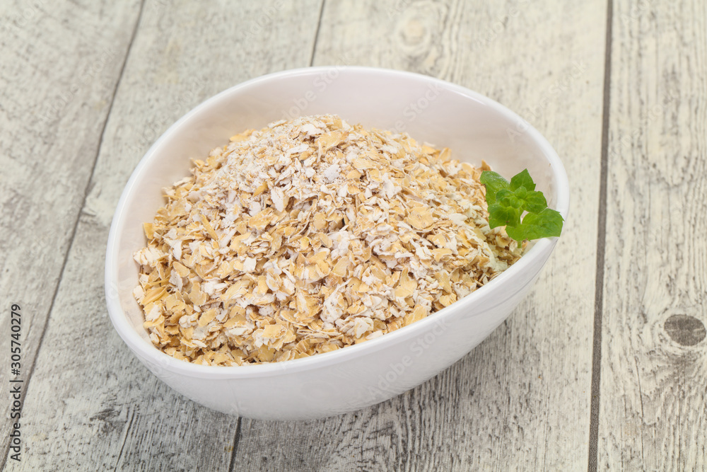 Raw oats in the bowl Raw oats in the bowl