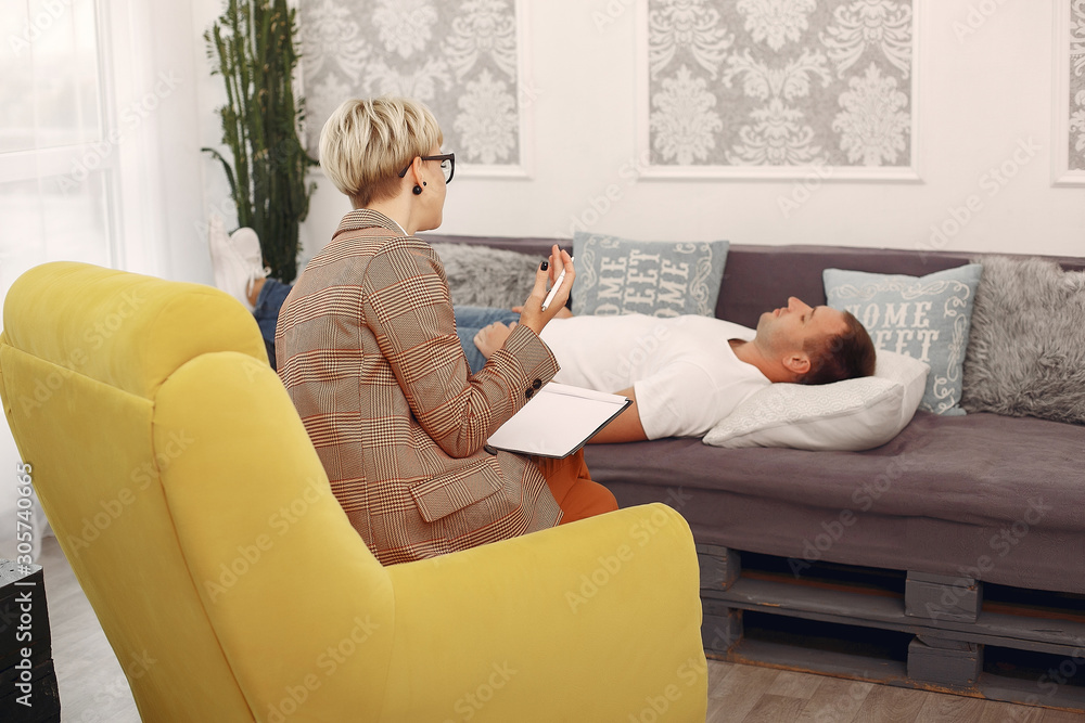 In the psychologist's office. Man and woman talking In the psychologist's office. Man and woman talking