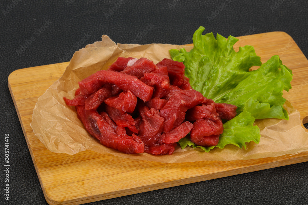 Raw beef meat sliced for cooking Raw beef meat sliced for cooking