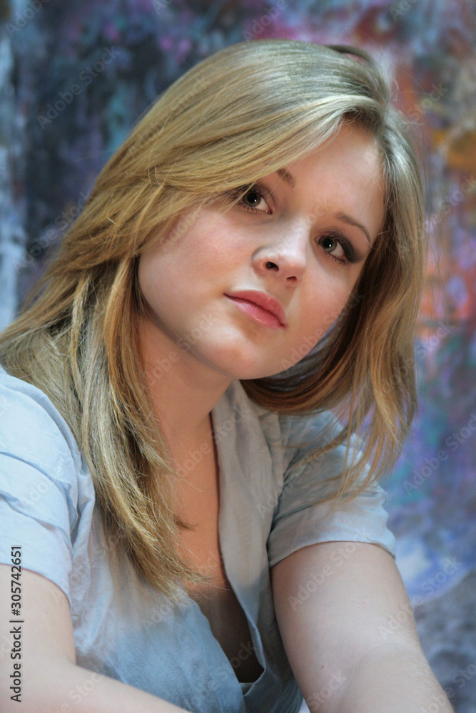 Portrait of a natural blonde. Teen girl on a colorful background Portrait of a natural blonde. Teen girl on a colorful background