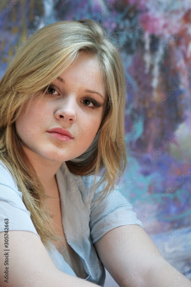 Portrait of a natural blonde. Teen girl on a colorful background Portrait of a natural blonde. Teen girl on a colorful background