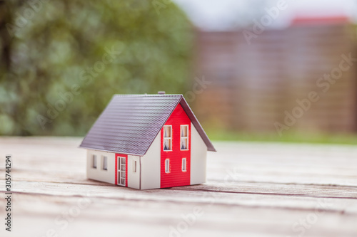 New home and house concept: Red house model outdoors