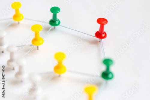 Group colorful pins on white. Structure, network marketing, social media concept.