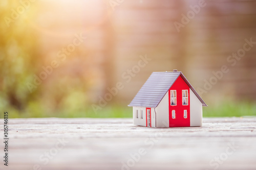 New home and house concept: Red house model outdoors